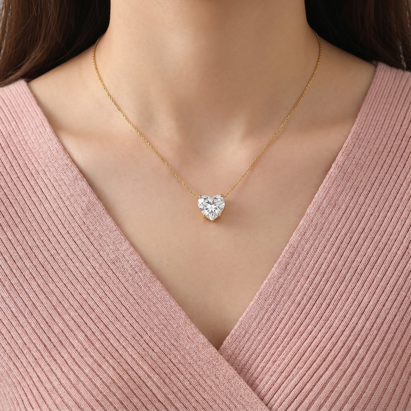Like a promise held close to the heart, this elegant necklace captures a timeless blend of love, brilliance, and graceful simplicity. Featuring a radiant heart-cut solitaire crystal suspended from a delicate golden chain, it creates a refined statement that feels romantic, meaningful, and effortlessly luxurious.