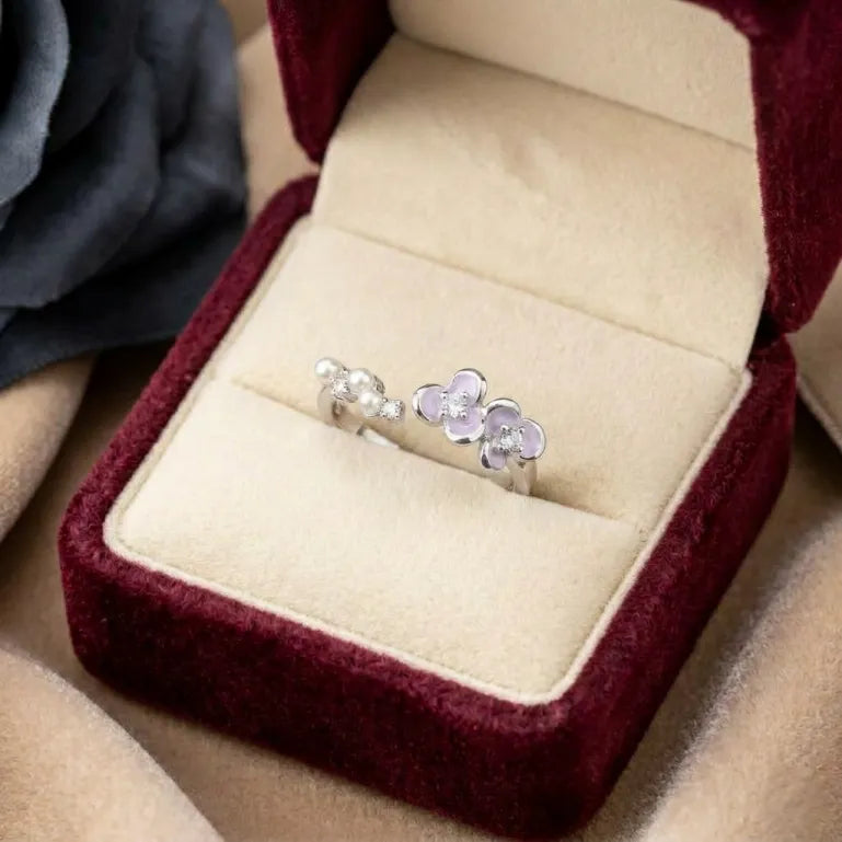 Inspired by the delicate beauty of blooming orchids, this ring captures a soft floral elegance adorned with luminous pearls and graceful butterfly-like petals. Its dreamy lavender tones and delicate details create a charming statement that feels feminine, whimsical, and effortlessly enchanting.