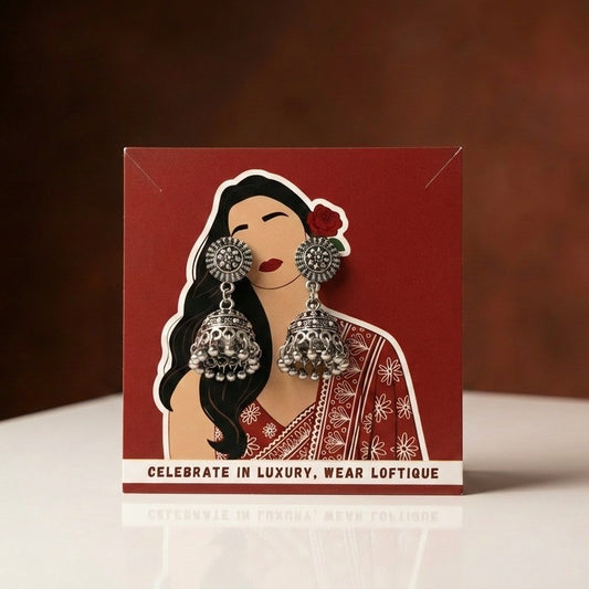 A soft whisper of tradition in a minimal form, this piece captures the charm of classic jhumka design in a delicate, everyday silhouette, The oxidized finish adds a vintage soul while the tiny ghungroo details bring subtle movement and grace