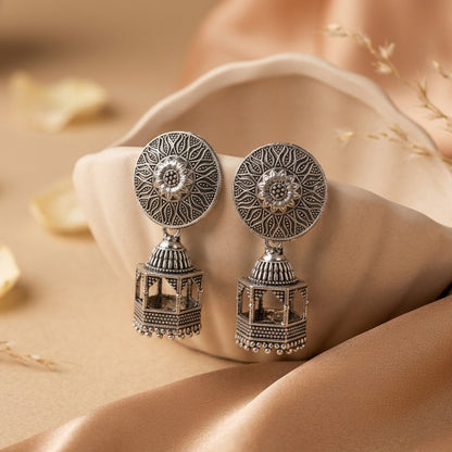 A statement of refined elegance with a hint of royal charm, this piece captures the beauty of intricate detailing and cascading movement in a truly graceful form. The ornate stud flows into delicate layered drops, creating a silhouette that feels both regal and mesmerizing with every motion.