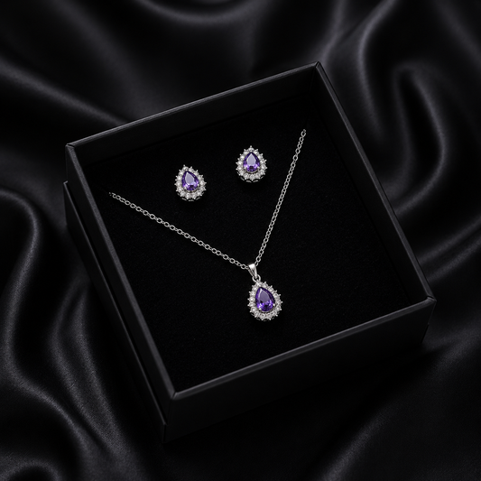 Drape yourself in the regal glow of the Amethyst Aura Set, a jewelry duo that captures the essence of sophisticated charm. With its deep violet hues and brilliant silver-toned accents, this set is designed to make every moment feel like a special occasion.