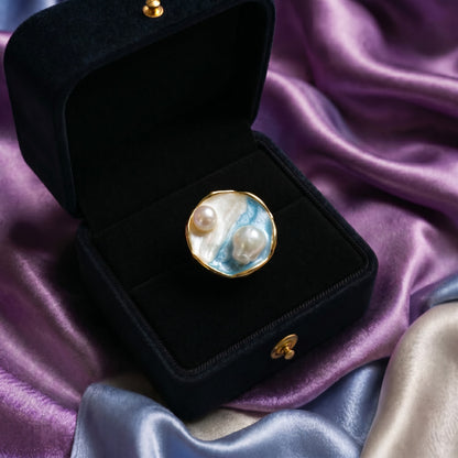 A collection of miniature artworks wrapped into wearable elegance, these rings blend flowing enamel textures, soft pastel tones, pearls, and shell-inspired details into a dreamy statement design. Each variant carries its own oceanic and artistic charm while staying beautifully cohesive as one collection.