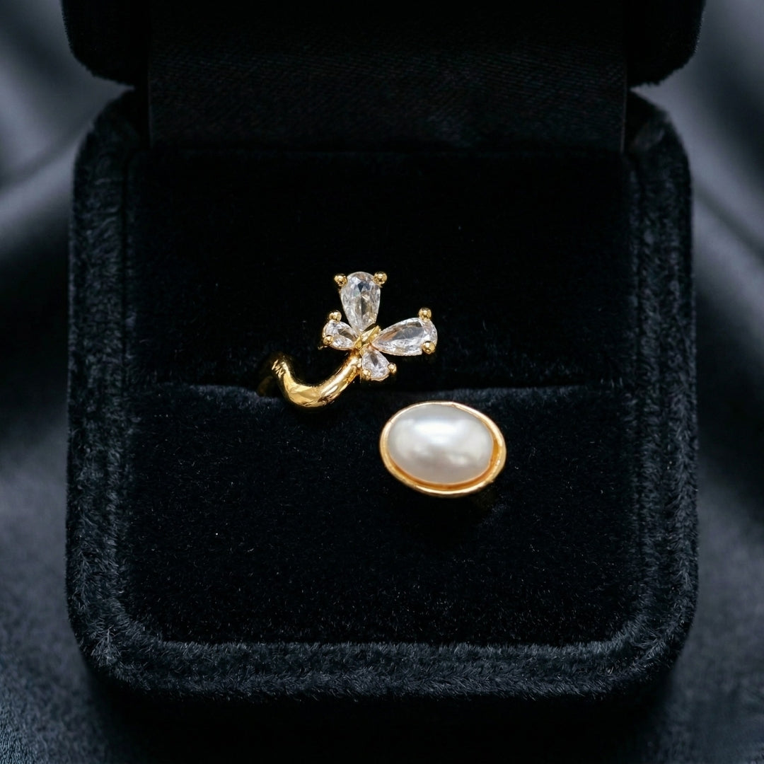The Aurelia Pearl Ring captures a soft, graceful charm in every detail. With its floral sparkle and luminous pearl accent, this adjustable design brings a gentle elegance that feels both playful and refined. Available exclusively at Loftique — your One Stop Gifting Solution,