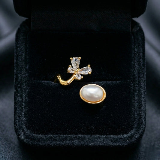 The Aurelia Pearl Ring captures a soft, graceful charm in every detail. With its floral sparkle and luminous pearl accent, this adjustable design brings a gentle elegance that feels both playful and refined. Available exclusively at Loftique — your One Stop Gifting Solution,