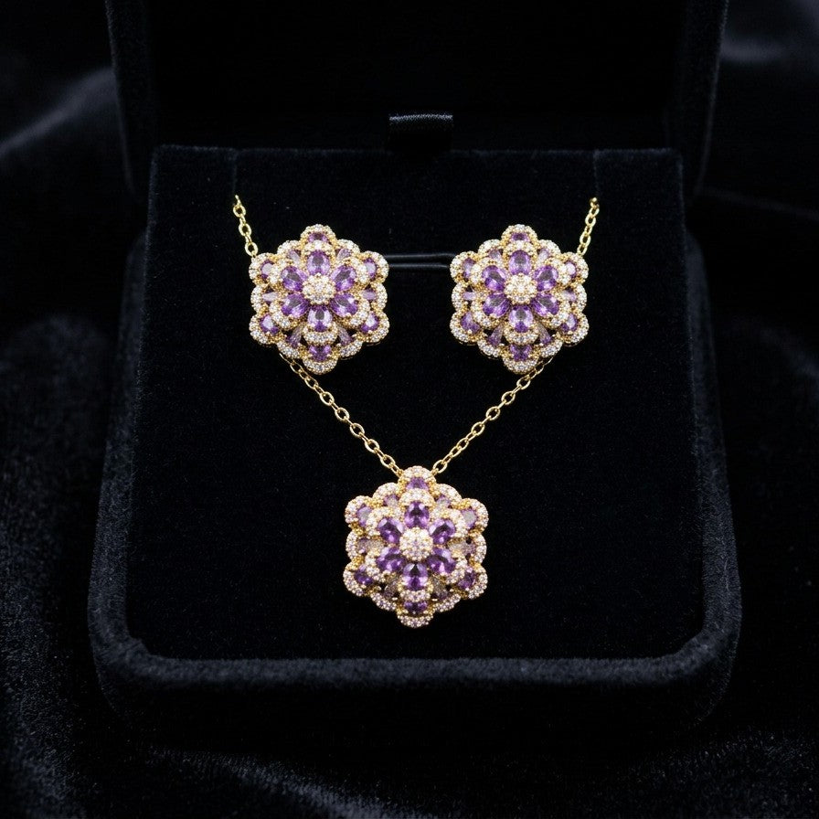 A delicate bloom captured in sparkle, the Blossom Radiance Set brings together floral elegance and luminous charm in a design that feels both graceful and radiant. Each shimmering petal reflects light beautifully, creating a soft glow that enhances your look with effortless femininity. Whether worn for a celebration or as a daily touch of elegance, this floral set adds a graceful sparkle to every moment.