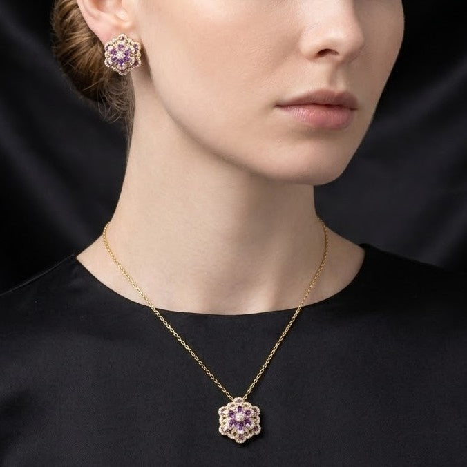 A delicate bloom captured in sparkle, the Blossom Radiance Set brings together floral elegance and luminous charm in a design that feels both graceful and radiant. Each shimmering petal reflects light beautifully, creating a soft glow that enhances your look with effortless femininity. Whether worn for a celebration or as a daily touch of elegance, this floral set adds a graceful sparkle to every moment.