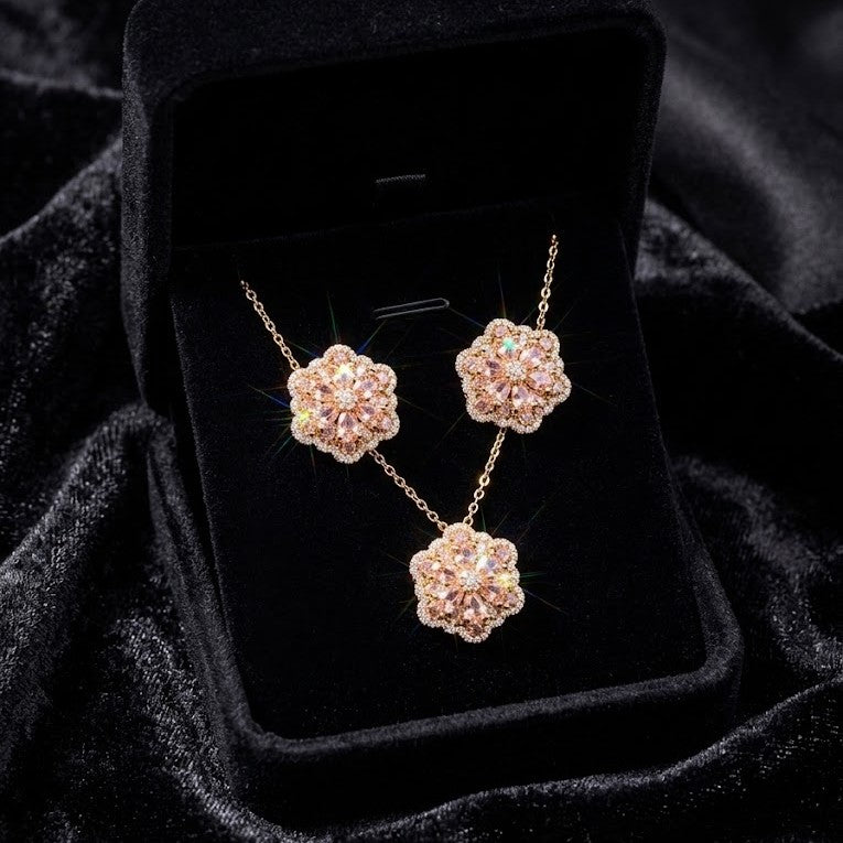 A delicate bloom captured in sparkle, the Blossom Radiance Set brings together floral elegance and luminous charm in a design that feels both graceful and radiant. Each shimmering petal reflects light beautifully, creating a soft glow that enhances your look with effortless femininity. Whether worn for a celebration or as a daily touch of elegance, this floral set adds a graceful sparkle to every moment.