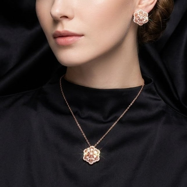 A delicate bloom captured in sparkle, the Blossom Radiance Set brings together floral elegance and luminous charm in a design that feels both graceful and radiant. Each shimmering petal reflects light beautifully, creating a soft glow that enhances your look with effortless femininity. Whether worn for a celebration or as a daily touch of elegance, this floral set adds a graceful sparkle to every moment.
