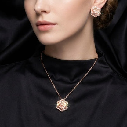 A delicate bloom captured in sparkle, the Blossom Radiance Set brings together floral elegance and luminous charm in a design that feels both graceful and radiant. Each shimmering petal reflects light beautifully, creating a soft glow that enhances your look with effortless femininity. Whether worn for a celebration or as a daily touch of elegance, this floral set adds a graceful sparkle to every moment.