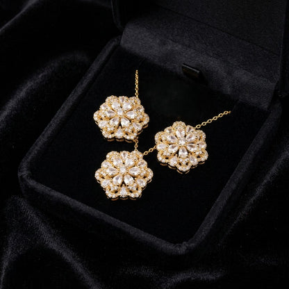 A delicate bloom captured in sparkle, the Blossom Radiance Set brings together floral elegance and luminous charm in a design that feels both graceful and radiant. Each shimmering petal reflects light beautifully, creating a soft glow that enhances your look with effortless femininity. Whether worn for a celebration or as a daily touch of elegance, this floral set adds a graceful sparkle to every moment.