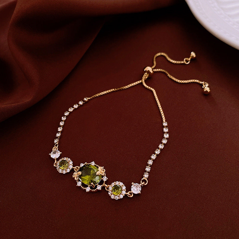 The Butterfly Garden Bracelet is a masterpiece of accessible luxury, featuring an exquisite oval-cut zircon center that radiates a high-end niche appeal. Available in enchanting Sage and Lilac variants, this pull-out bracelet offers a refined fashion statement that brings the delicate beauty of a blooming garden directly to your wrist.