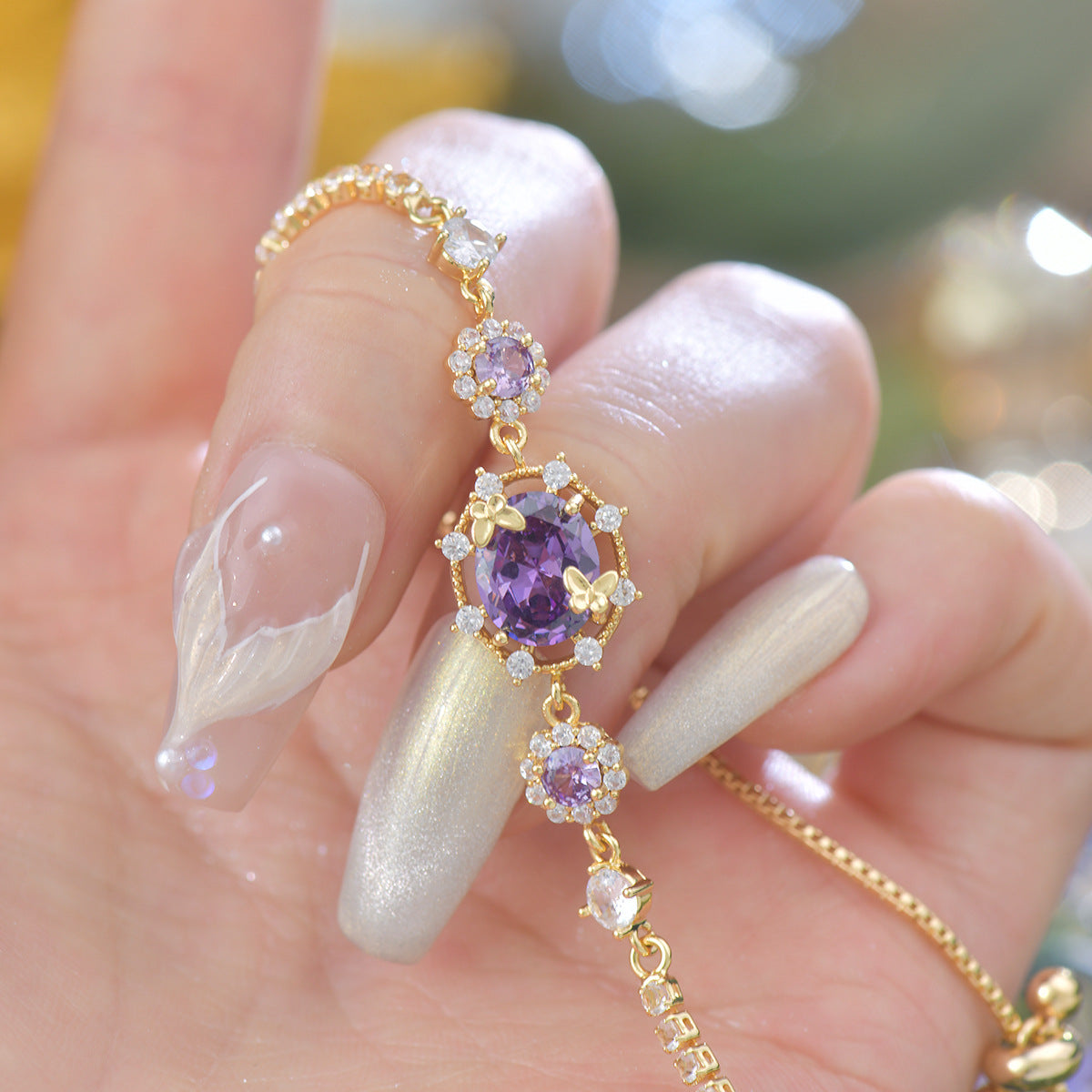 The Butterfly Garden Bracelet is a masterpiece of accessible luxury, featuring an exquisite oval-cut zircon center that radiates a high-end niche appeal. Available in enchanting Sage and Lilac variants, this pull-out bracelet offers a refined fashion statement that brings the delicate beauty of a blooming garden directly to your wrist.