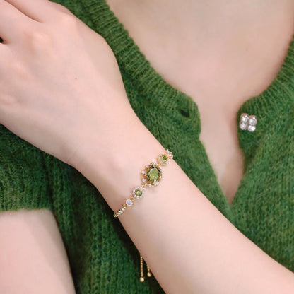 The Butterfly Garden Bracelet is a masterpiece of accessible luxury, featuring an exquisite oval-cut zircon center that radiates a high-end niche appeal. Available in enchanting Sage and Lilac variants, this pull-out bracelet offers a refined fashion statement that brings the delicate beauty of a blooming garden directly to your wrist.