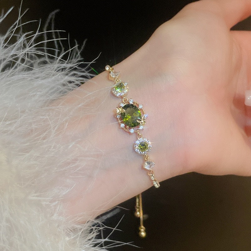 The Butterfly Garden Bracelet is a masterpiece of accessible luxury, featuring an exquisite oval-cut zircon center that radiates a high-end niche appeal. Available in enchanting Sage and Lilac variants, this pull-out bracelet offers a refined fashion statement that brings the delicate beauty of a blooming garden directly to your wrist.