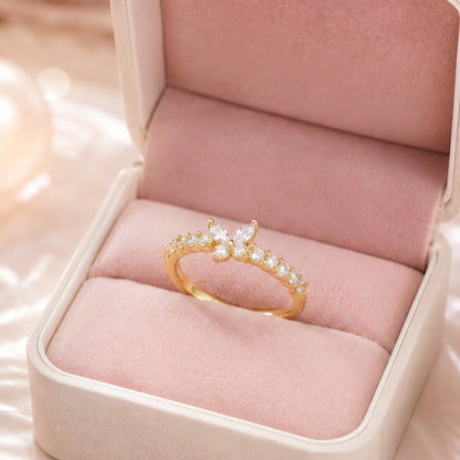 Like a radiant butterfly resting beneath the morning light, this elegant ring captures a graceful blend of freedom, sparkle, and feminine beauty. Featuring a delicate crystal butterfly rising above a shimmering stone-lined band, it creates a refined statement that feels enchanting, graceful, and effortlessly luxurious