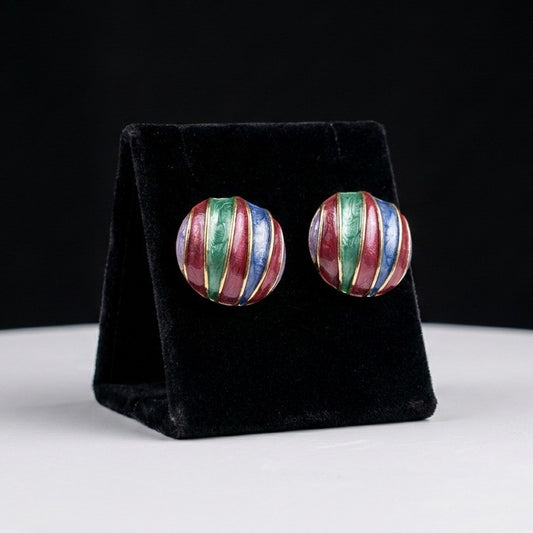 A playful celebration of color and vintage charm, these earrings feature flowing enamel stripes in rich jewel tones that create a bold artistic statement. Their rounded silhouette and vibrant palette bring a retro elegance full of personality and joy.