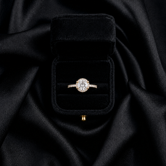 A radiant circle of shimmering light, this ring captures the celestial beauty of stars wrapped in timeless elegance. Featuring a brilliant crystal centerpiece surrounded by a delicate halo sparkle, it creates a graceful glow that feels luxurious, dreamy, and endlessly feminine.