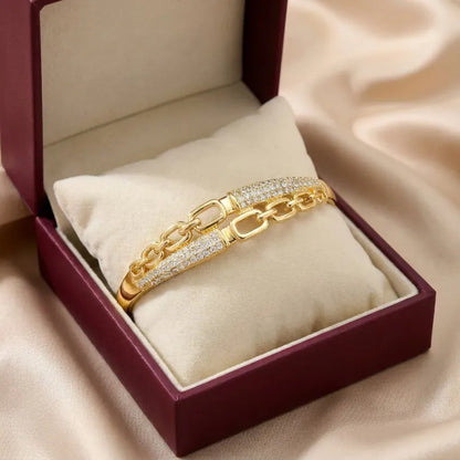 A bold chain silhouette softened with crystal elegance, this bracelet captures the beauty of modern links wrapped in a polished luxury finish. With its open-link design and shimmering pavé details, it creates a refined statement that feels stylish, premium, and effortlessly confident.