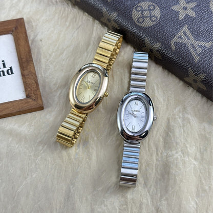 A refined oval dial wrapped in a smooth designed to move effortlessly with your everyday moments. Minimal yet expressive, this watch brings quiet luxury to every wrist — perfect for daily wear or thoughtful gifting.
