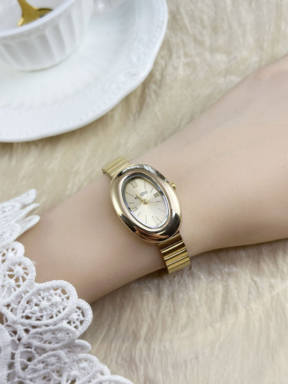 A refined oval dial wrapped in a smooth golden frame, designed to move effortlessly with your everyday moments. Minimal yet expressive, this watch brings quiet luxury to every wrist — perfect for daily wear or thoughtful gifting.
