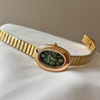 A refined oval dial wrapped in a smooth golden frame, designed to move effortlessly with your everyday moments. Minimal yet expressive, this watch brings quiet luxury to every wrist — perfect for daily wear or thoughtful gifting.