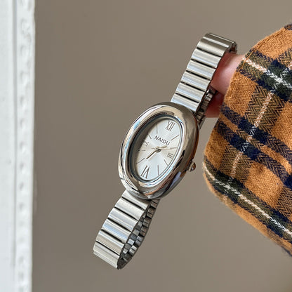 A refined oval dial wrapped in a smooth silver frame, designed to move effortlessly with your everyday moments. Minimal yet expressive, this watch brings quiet luxury to every wrist — perfect for daily wear or thoughtful gifting.