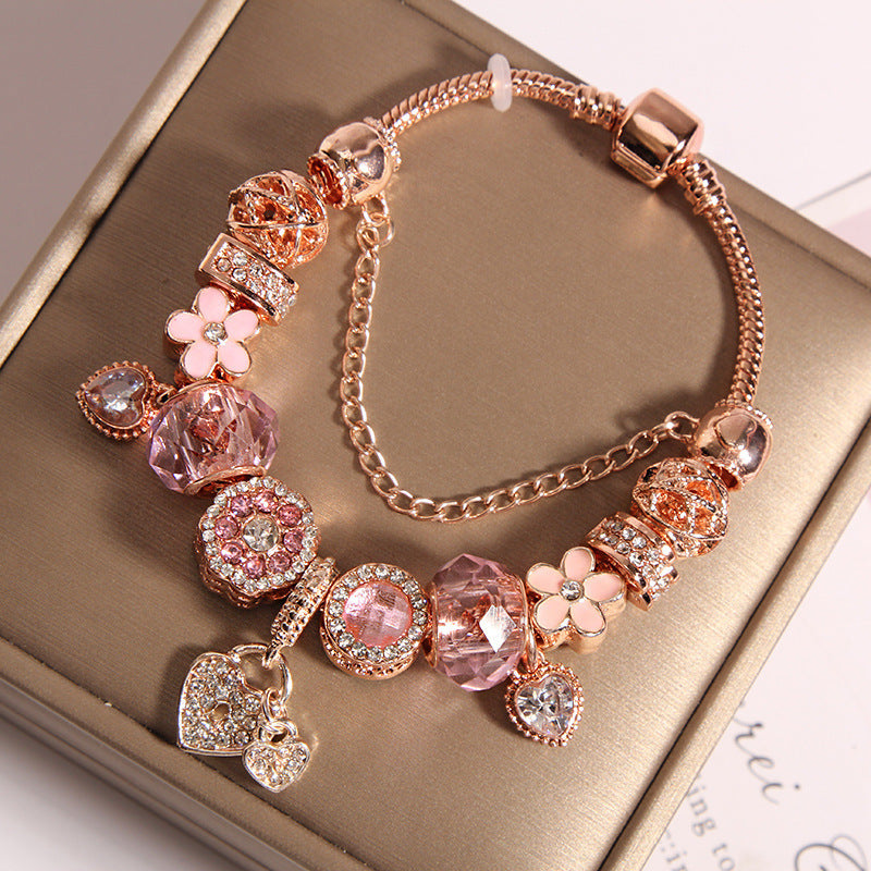 A romantic rose-gold or dreamy lilac,&nbsp;these bracelets are defined by a&nbsp;crystal center and a heart-and dream catcher-flower charm frame. The Dreamveil Charm Bracelets feel like a soft fairytale on your wrist—sweet sparkle, delicate details, and that “gifted with love” kind of glow.


