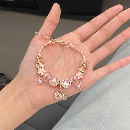 A romantic rose-gold or dreamy lilac,&nbsp;these bracelets are defined by a&nbsp;crystal center and a heart-and dream catcher-flower charm frame. The Dreamveil Charm Bracelets feel like a soft fairytale on your wrist—sweet sparkle, delicate details, and that “gifted with love” kind of glow.

