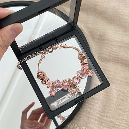 A romantic rose-gold or dreamy lilac,&nbsp;these bracelets are defined by a&nbsp;crystal center and a heart-and dream catcher-flower charm frame. The Dreamveil Charm Bracelets feel like a soft fairytale on your wrist—sweet sparkle, delicate details, and that “gifted with love” kind of glow.

