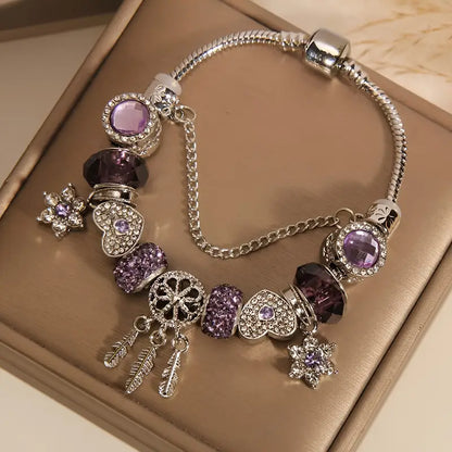 A romantic rose-gold or dreamy lilac,&nbsp;these bracelets are defined by a&nbsp;crystal center and a heart-and dream catcher-flower charm frame. The Dreamveil Charm Bracelets feel like a soft fairytale on your wrist—sweet sparkle, delicate details, and that “gifted with love” kind of glow.

