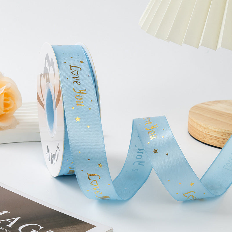 ES Ribbons are designed to add the perfect finishing touch to every gift. Crafted from soft fabric and detailed with elegant gold heart accents, these ribbons instantly elevate your packaging with warmth, love, and a premium feel.