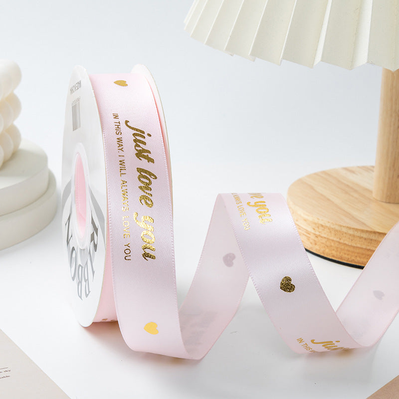 ES Ribbons are designed to add the perfect finishing touch to every gift. Crafted from soft fabric and detailed with elegant gold heart accents, these ribbons instantly elevate your packaging with warmth, love, and a premium feel.