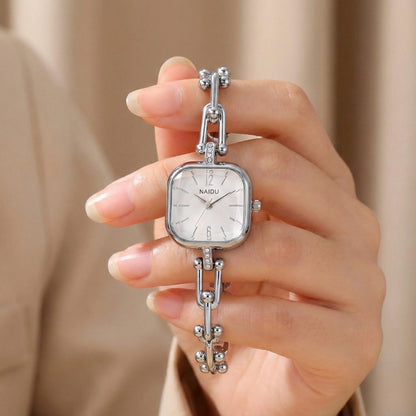 The Elite Eternity Watch redefines elegance with its sophisticated square small dial and a light luxury Cuban-inspired strap. This timepiece seamlessly blends the bold aesthetic of a high-end bracelet with the precision of a modern quartz movement, making it a standout accessory for any trendsetting wardrobe.