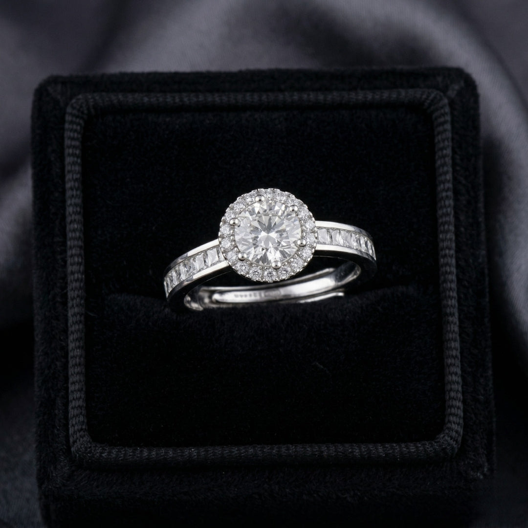 Elyra Spark Ring is a graceful blend of brilliance and simplicity, featuring a radiant zircon centerpiece surrounded by a fine halo of shimmering stones. Its sleek band, accented with subtle crystal detailing, enhances the overall sparkle while maintaining an elegant, minimal look. Designed to shine effortlessly, this ring adds a refined glow to both everyday moments and special occasions.