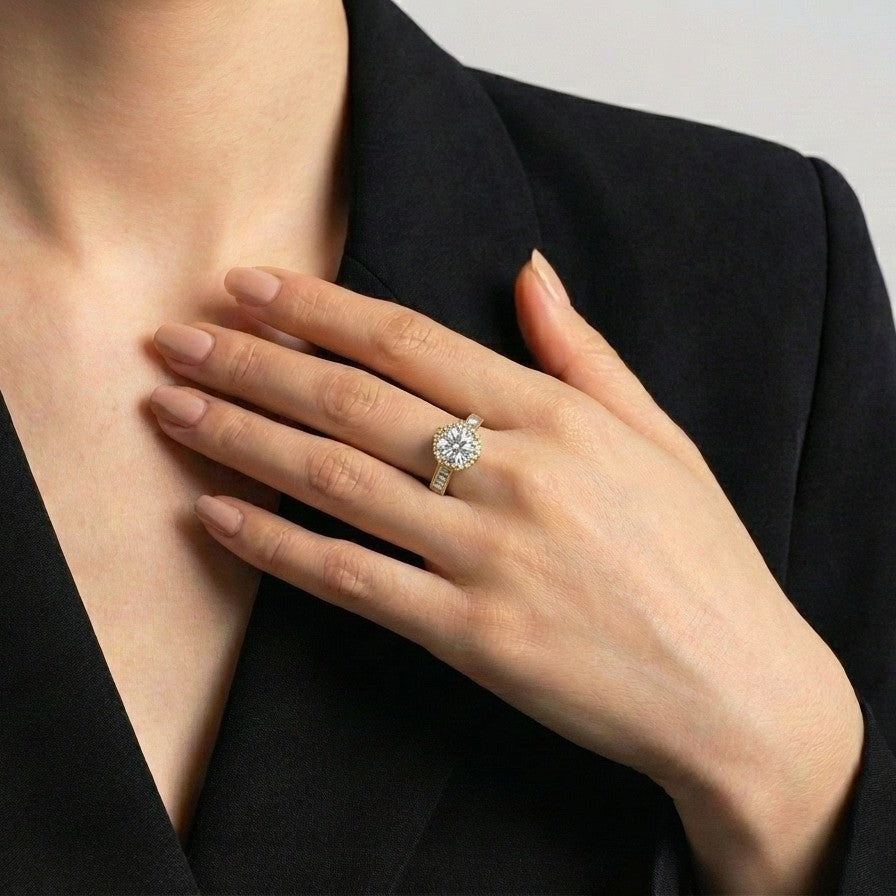 Elyra Spark Ring is a graceful blend of brilliance and simplicity, featuring a radiant zircon centerpiece surrounded by a fine halo of shimmering stones. Its sleek band, accented with subtle crystal detailing, enhances the overall sparkle while maintaining an elegant, minimal look. Designed to shine effortlessly, this ring adds a refined glow to both everyday moments and special occasions.
