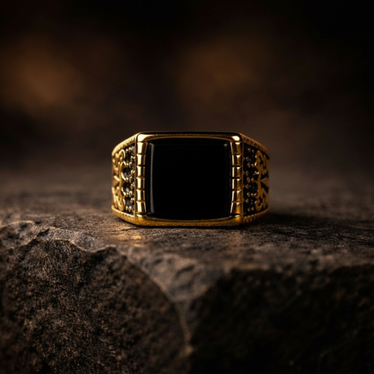 Minimal yet commanding, the Envy Prime Ring is designed around precision and power. Its sharp rectangular black stone sits confidently in a rich gold-tone body, creating a striking contrast that speaks of dominance, refinement, and quiet authority. This is luxury at its peak, nothing excess, nothing ordinary.