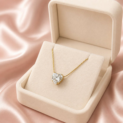Like a promise held close to the heart, this elegant necklace captures a timeless blend of love, brilliance, and graceful simplicity. Featuring a radiant heart-cut solitaire crystal suspended from a delicate golden chain, it creates a refined statement that feels romantic, meaningful, and effortlessly luxurious.