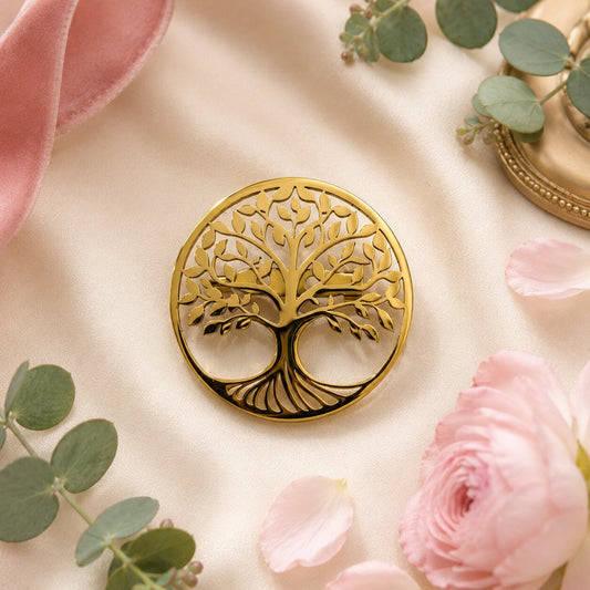 Like an ancient tree growing through generations, this elegant brooch captures a beautiful sense of strength, connection, and timeless growth. Featuring an intricate tree silhouette enclosed within a polished circular frame, it creates a meaningful statement that feels graceful, symbolic, and effortlessly luxurious.
