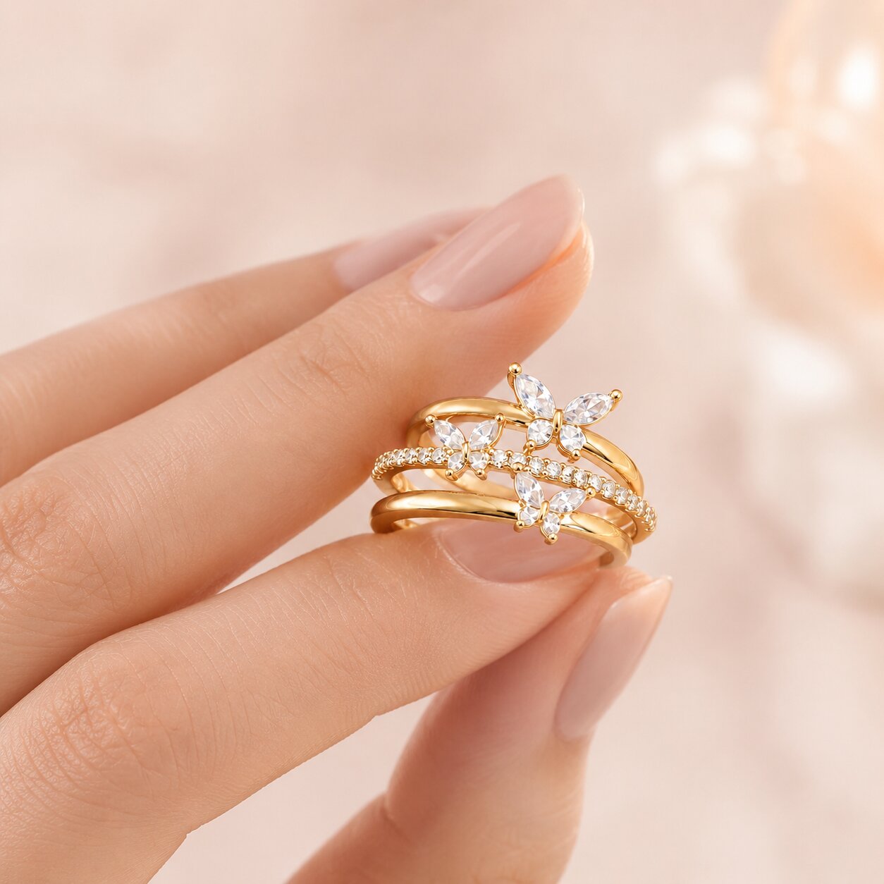 Like butterflies dancing through a sparkling cascade, this elegant ring captures a beautiful sense of freedom, movement, and delicate femininity. Featuring graceful butterfly motifs arranged across flowing crystal-studded bands, it creates a radiant statement that feels enchanting, refined, and effortlessly luxurious
