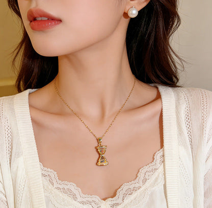 Premium Hourglass Lumina Necklace from Loftique BD: High-grade titanium steel hourglass pendant necklace encrusted with brilliant zircon stones. Available in Aurum Hour gold and Forest Hour silver finishes. The best gift for her and a perfect for gifting choice for milestone anniversaries, birthdays, or long-distance relationships in Bangladesh. Shop this exclusive one-stop gifting solution at the top-rated gift shop in BD, available only at Loftique.