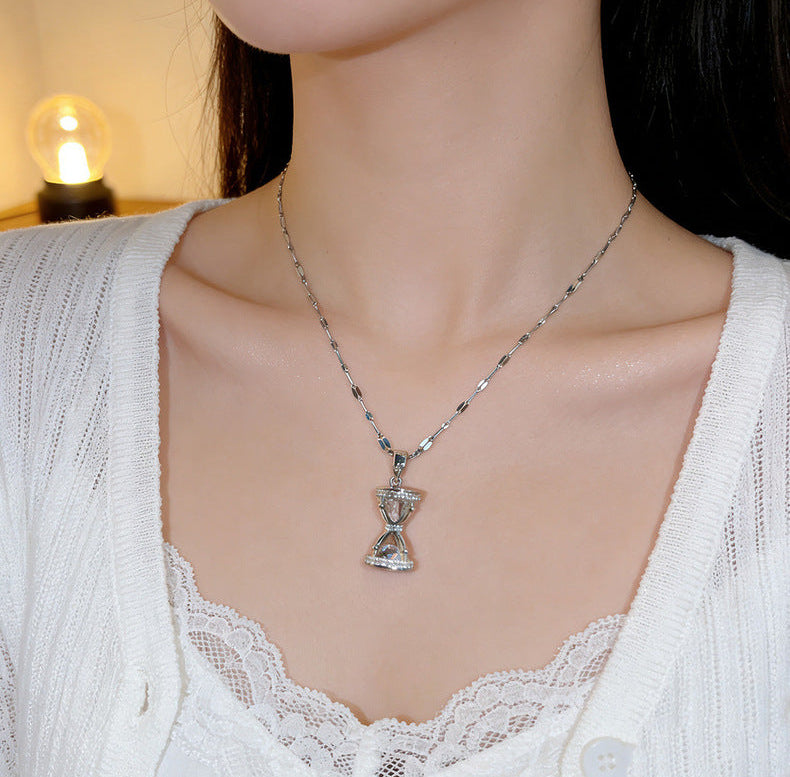 Premium Hourglass Lumina Necklace from Loftique BD: High-grade titanium steel hourglass pendant necklace encrusted with brilliant zircon stones. Available in Aurum Hour gold and Forest Hour silver finishes. The best gift for her and a perfect for gifting choice for milestone anniversaries, birthdays, or long-distance relationships in Bangladesh. Shop this exclusive one-stop gifting solution at the top-rated gift shop in BD, available only at Loftique.