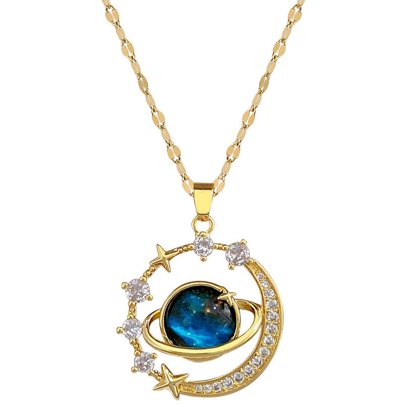 The Infinity Galaxy Necklace, a celestial masterpiece designed to capture the magic of the cosmos. Featuring a luminous deep blue planet orbited by shimmering cubic zirconia stars, this pendant is beautifully framed in a radiant gold-tone setting, perfect for dreamers, stargazers, and lovers of unique jewelry.