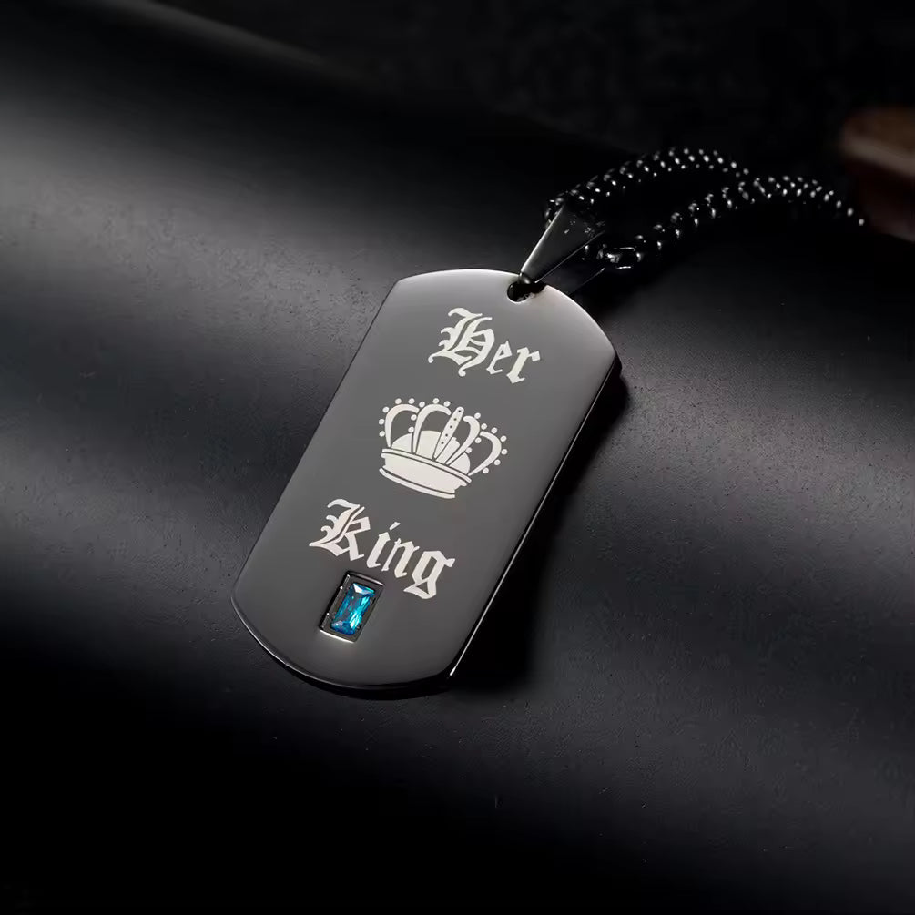 A bold symbol of confidence and connection, this necklace brings a strong, masculine edge with a meaningful touch. With its sleek tag design and engraved crown detail, it represents loyalty, love, and the quiet power of being someone’s king.