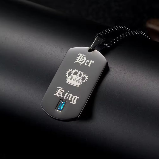 A bold symbol of confidence and connection, this necklace brings a strong, masculine edge with a meaningful touch. With its sleek tag design and engraved crown detail, it represents loyalty, love, and the quiet power of being someone’s king.