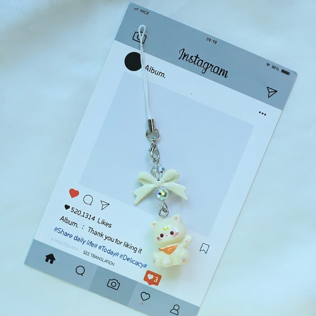 A tiny pop of cuteness designed to brighten your everyday essentials, this playful kitty charm brings a soft, joyful vibe wherever it goes. Finished with a delicate bow and subtle sparkle detail, it’s the perfect little accessory to add personality to your phone, bag, or keys.