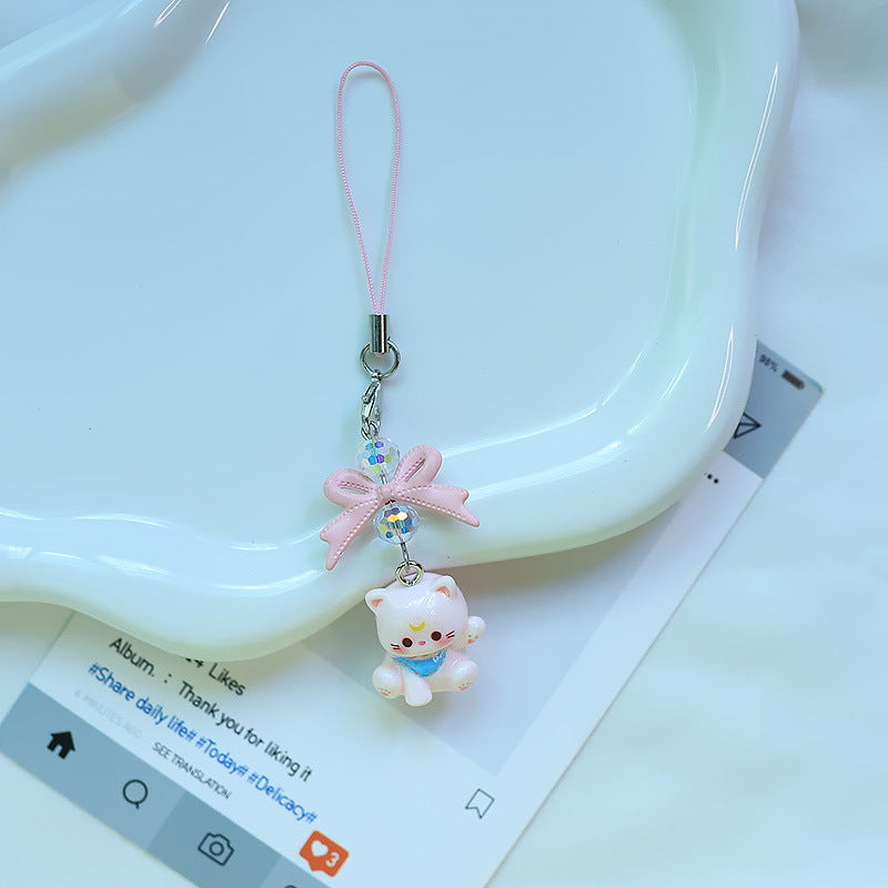 A tiny pop of cuteness designed to brighten your everyday essentials, this playful kitty charm brings a soft, joyful vibe wherever it goes. Finished with a delicate bow and subtle sparkle detail, it’s the perfect little accessory to add personality to your phone, bag, or keys.