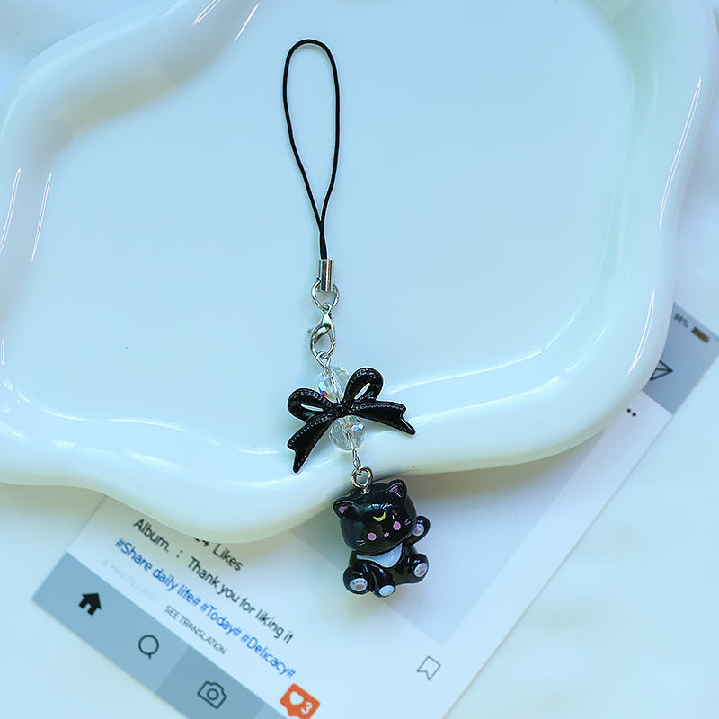A tiny pop of cuteness designed to brighten your everyday essentials, this playful kitty charm brings a soft, joyful vibe wherever it goes. Finished with a delicate bow and subtle sparkle detail, it’s the perfect little accessory to add personality to your phone, bag, or keys.