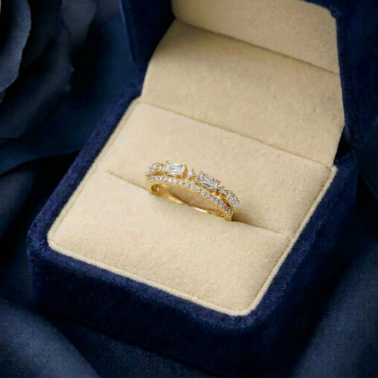 A delicate line of brilliance wrapped in timeless elegance, this ring features shimmering stones arranged in a graceful crown-like silhouette. Its refined band design and soft sparkle create a look that feels minimal, elegant, and effortlessly luxurious.