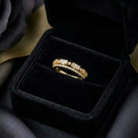 A delicate line of brilliance wrapped in timeless elegance, this ring features shimmering stones arranged in a graceful crown-like silhouette. Its refined band design and soft sparkle create a look that feels minimal, elegant, and effortlessly luxurious.