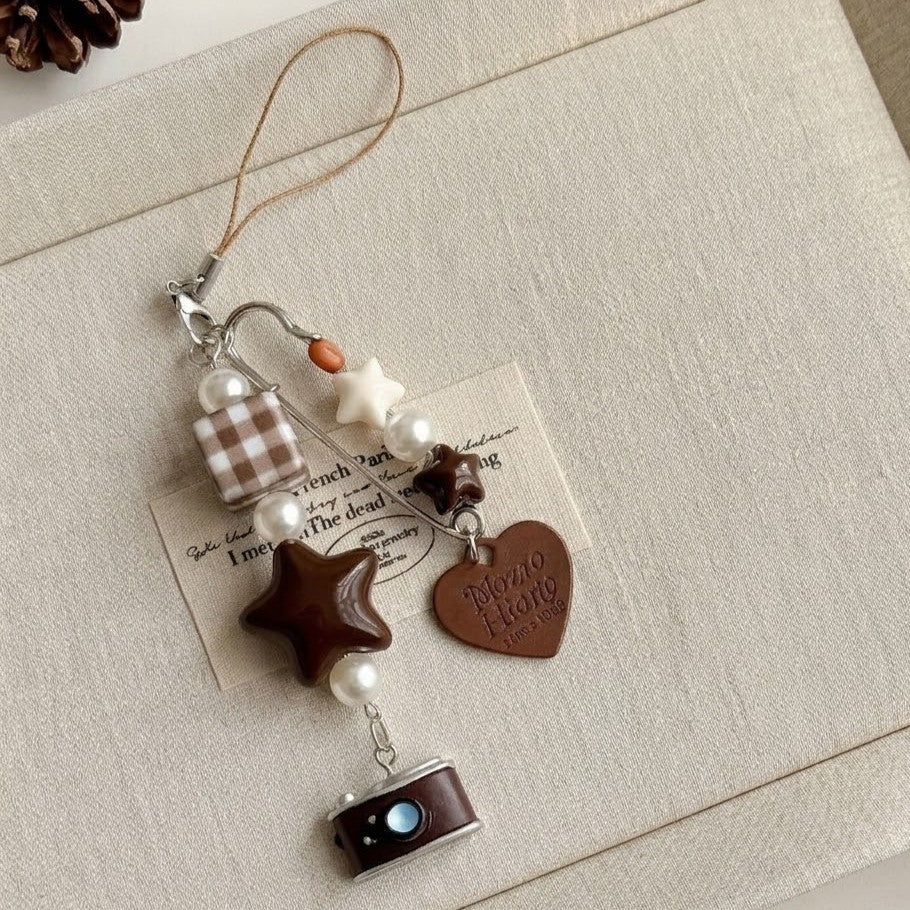 A little story you can carry everywhere — warm, nostalgic, and softly detailed. The Mocha Diary Charm blends cozy café tones with playful elements, creating a charming piece that feels both aesthetic and personal, like a memory captured in miniature.